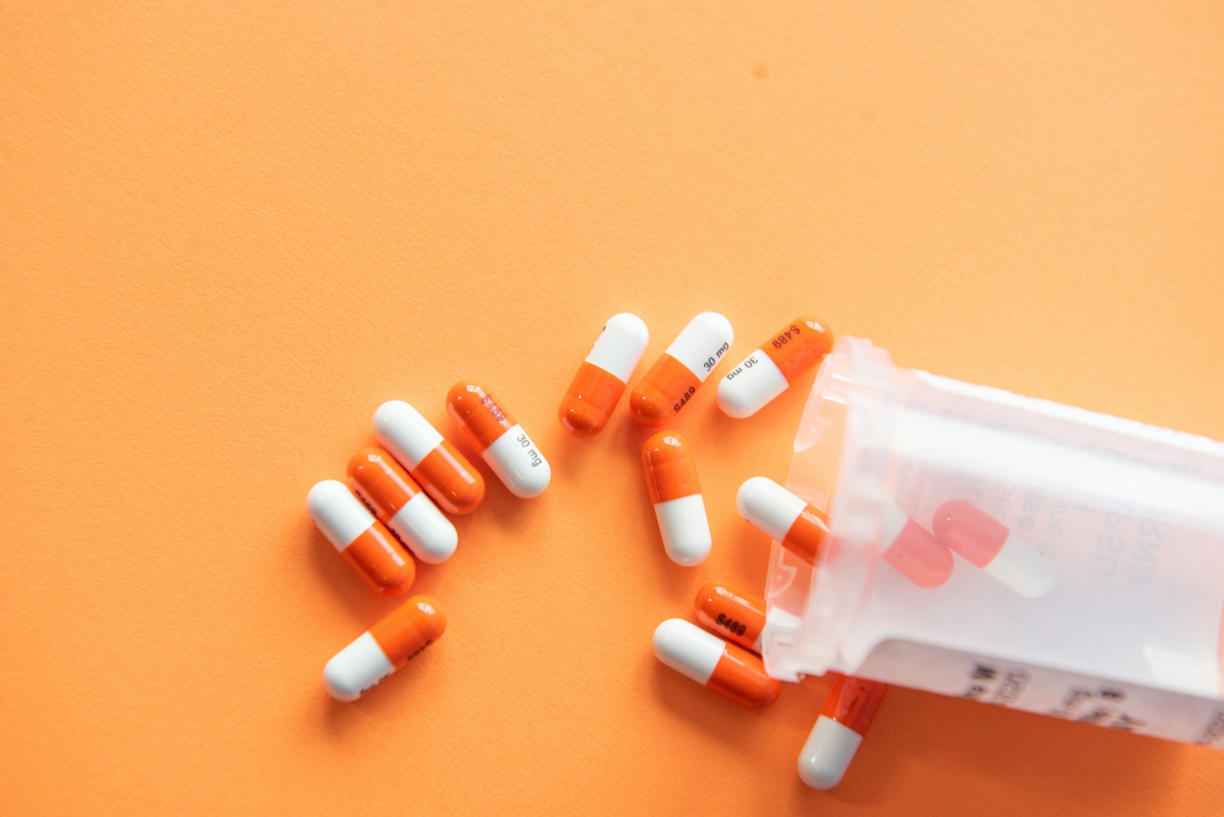 White prescription capsules on clean surface
